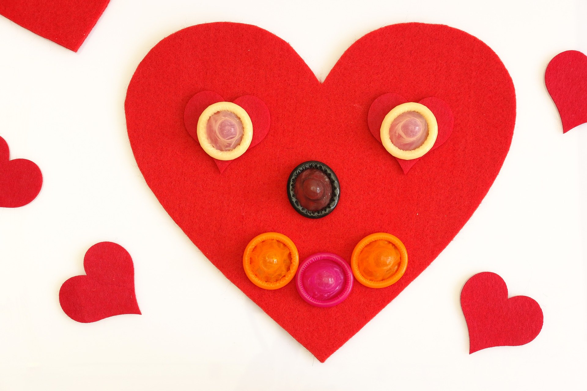 Day of the Condom - Red heart with Condoms
