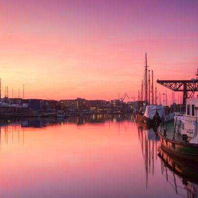 City port of Rostock in pink light of dusk